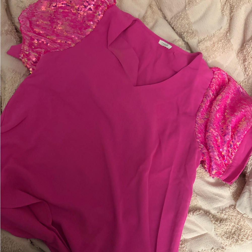 Boutique top. A beautiful pink blouse with sleeve cap sequins. Small v neck.